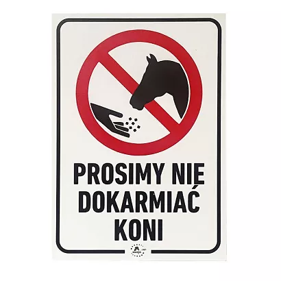 Information board in Polish “Prosimy nie dokarmiać koni”