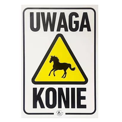 Information board in Polish " UWAGA Konie!"